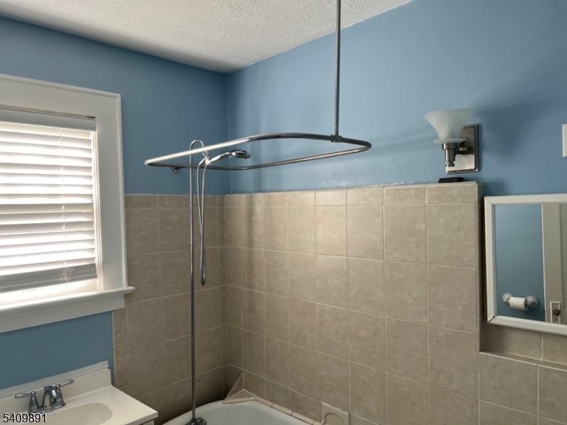 12 John Street Summit, NJ 07901 - Photo 2 of 9 a bathroom with a shower and a toilet