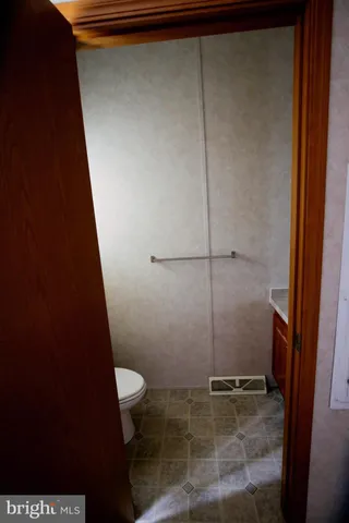 a bathroom with a granite countertop sink