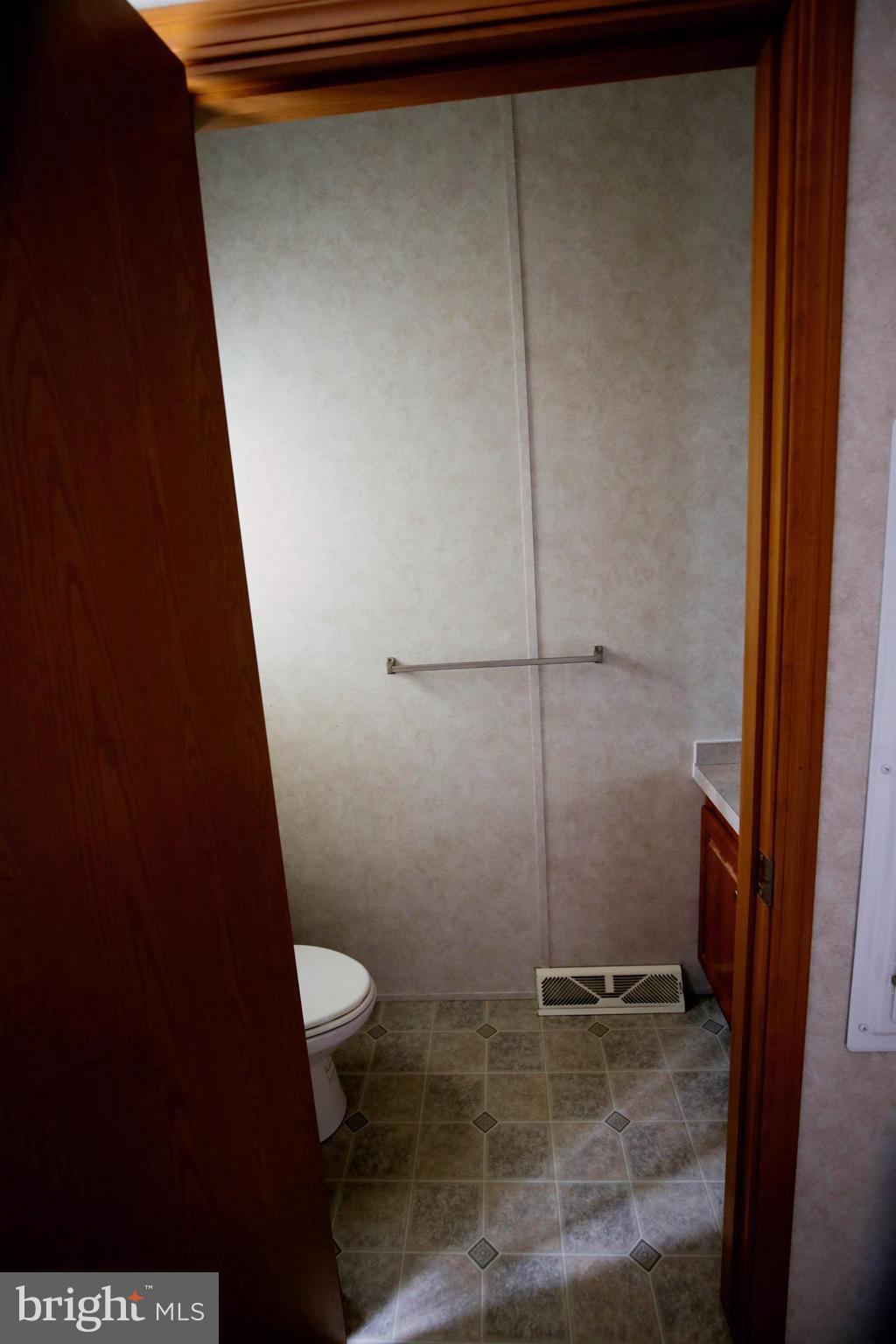 2437 Lebanon Road Manheim, PA 17545 - Photo 16 of 26 a bathroom with a granite countertop sink