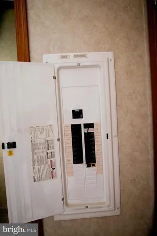 a close view of a utility room with dryer and washer