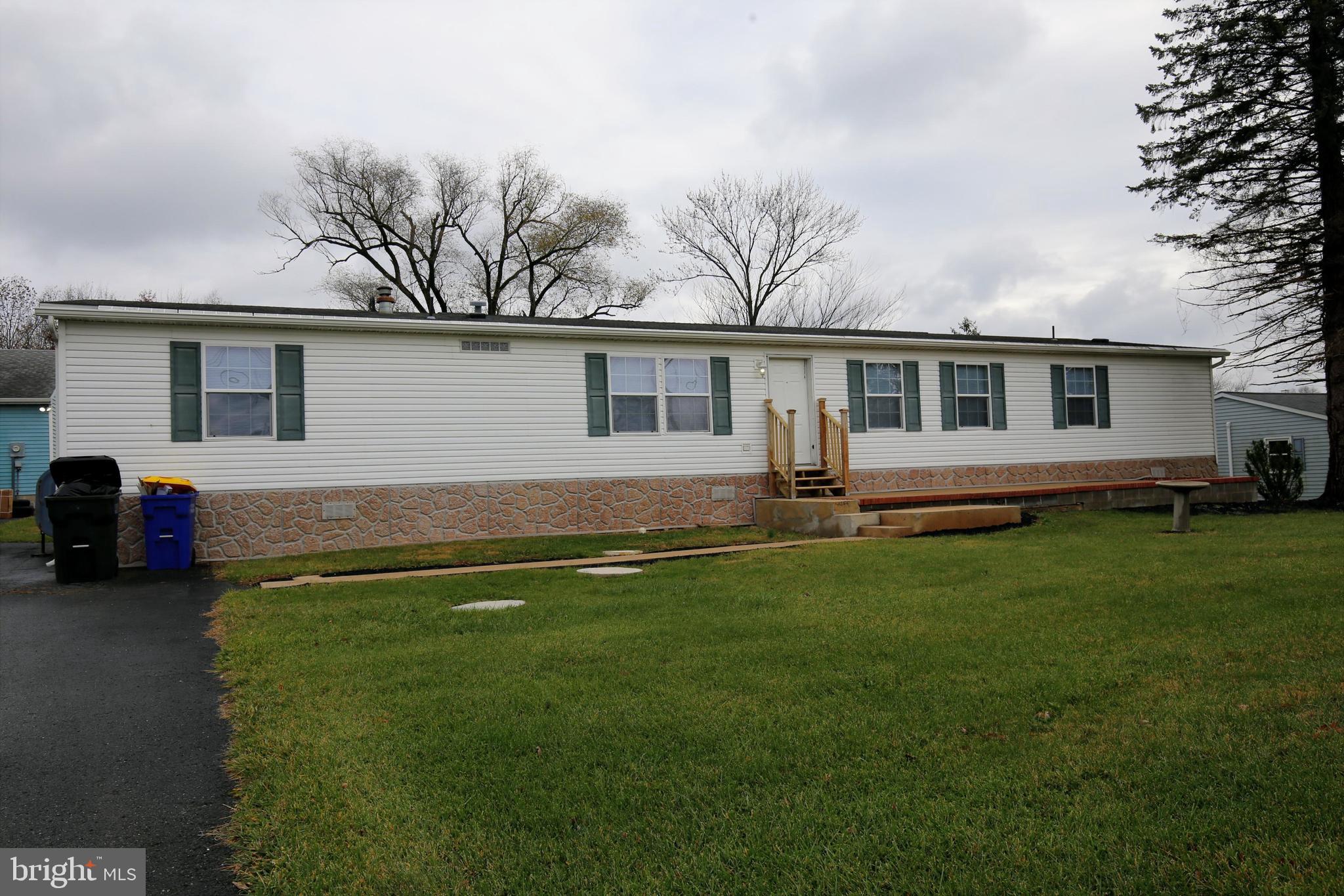 2437 Lebanon Road Manheim, PA 17545 - Photo 2 of 26 a front view of house with yard and green space