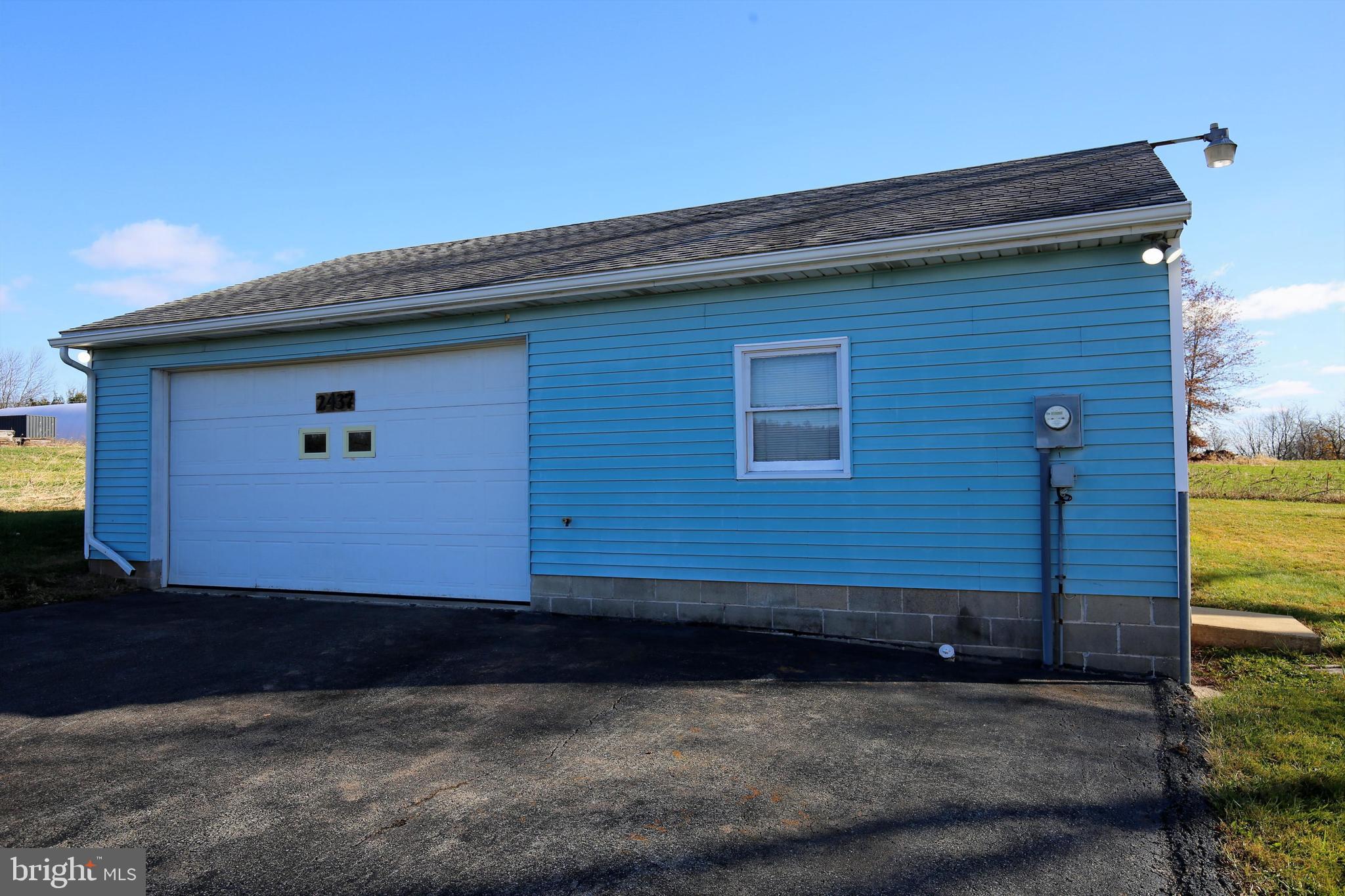 2437 Lebanon Road Manheim, PA 17545 - Photo 23 of 26 a front view of a house with garage