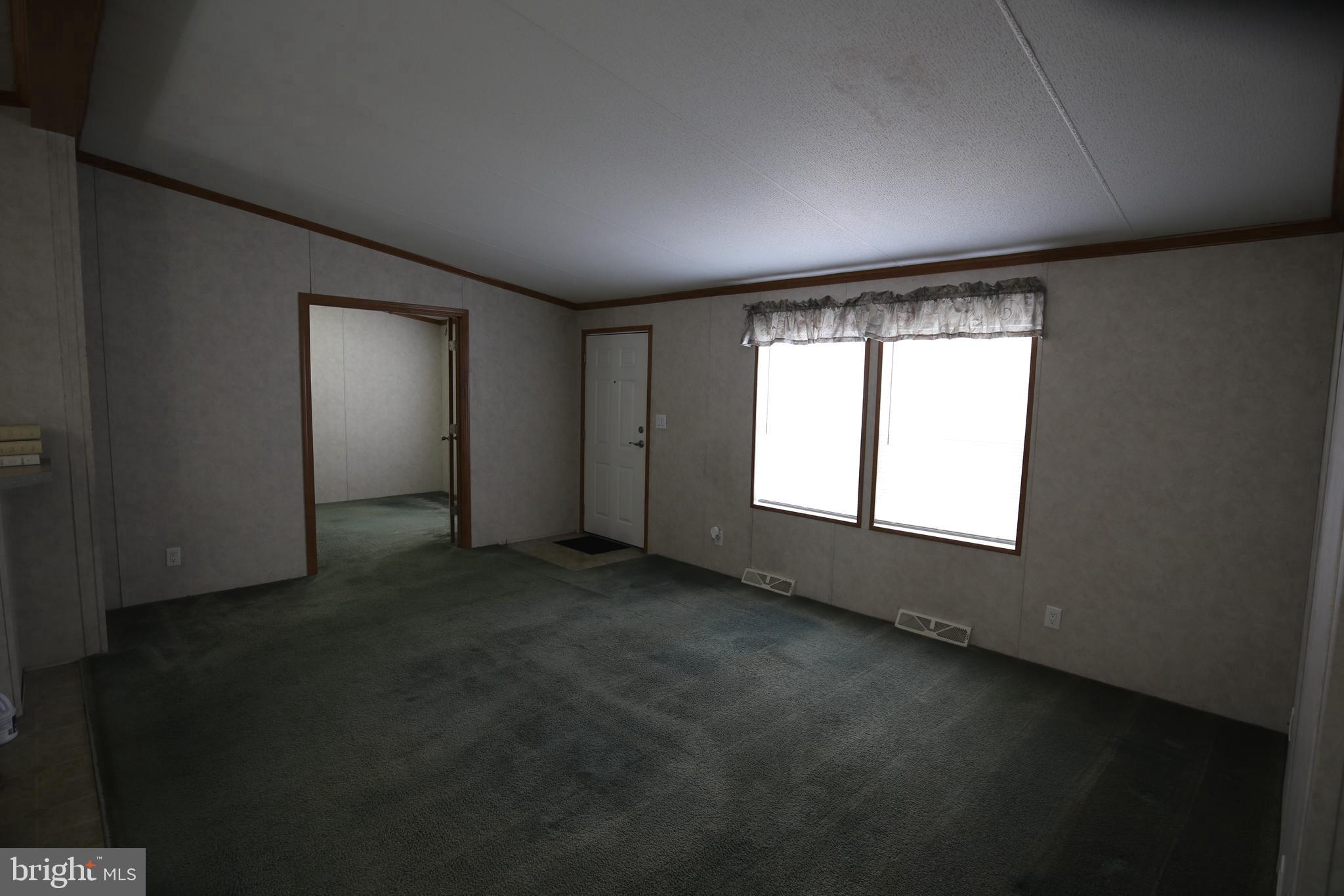 2437 Lebanon Road Manheim, PA 17545 - Photo 3 of 26 an empty room with a empty space and windows