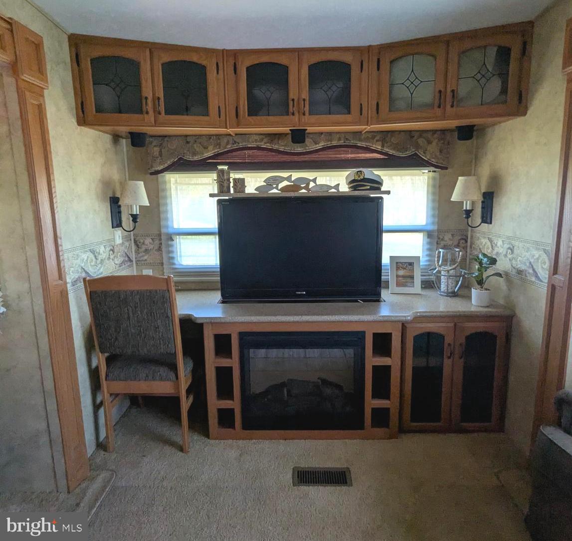 8 Ranger Road Falling Waters, WV 25419 - Photo 11 of 18 a living room with furniture and a fireplace