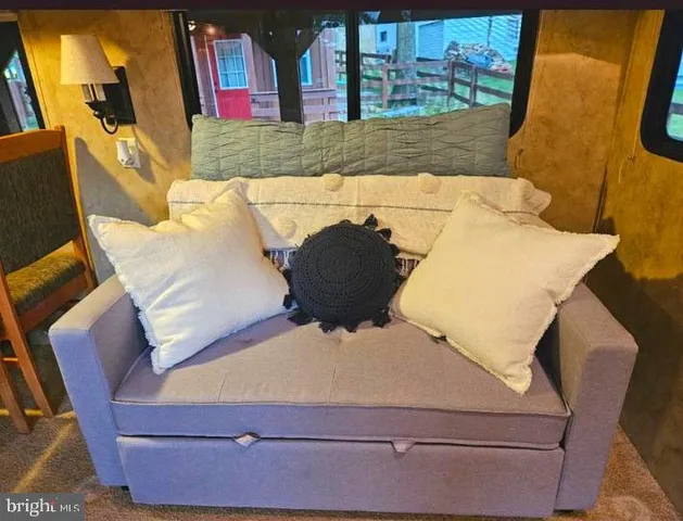 a room with a chair and wooden floor