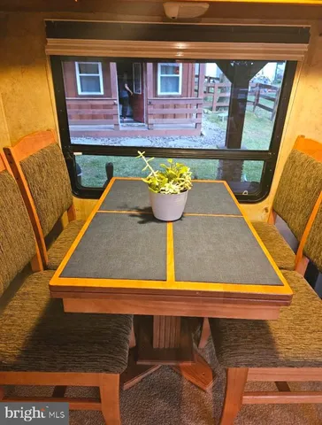 a outdoor space with the couches and dining table