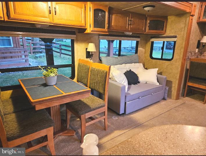 8 Ranger Road Falling Waters, WV 25419 - Photo 17 of 18 a outdoor space with the couches and dining table