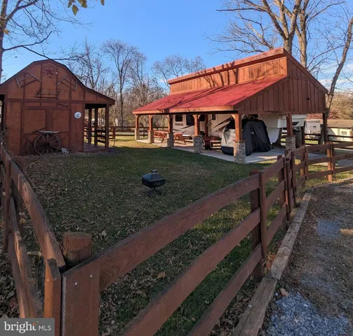 a view of a yard with an outdoor seating