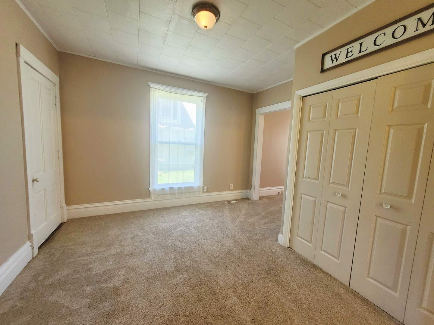 505 East Main Street Morrison, IL 61270 - Photo 13 of 27 a view of an empty room and window