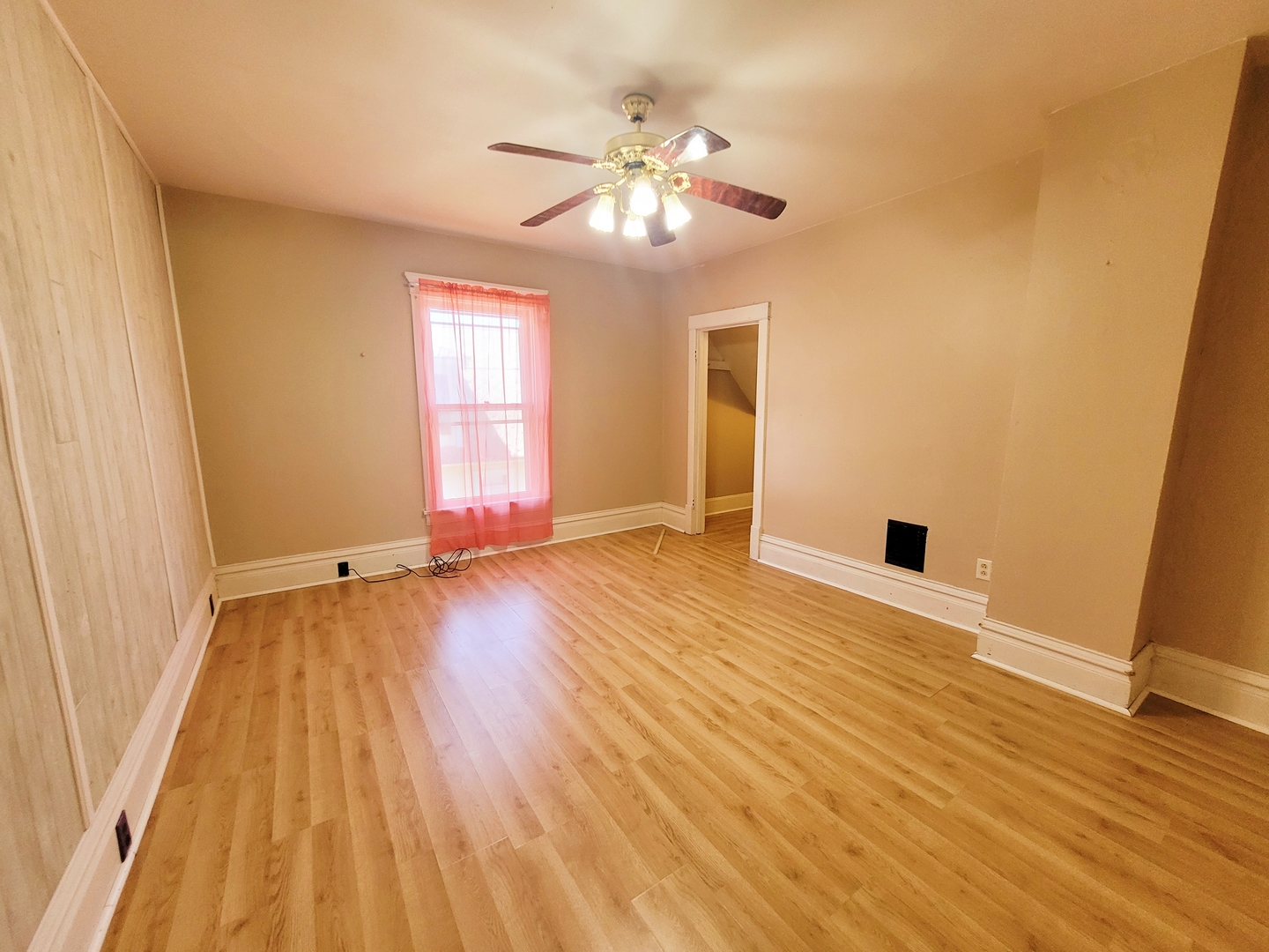 505 East Main Street Morrison, IL 61270 - Photo 21 of 27 a view of an empty room with wooden floor and a window