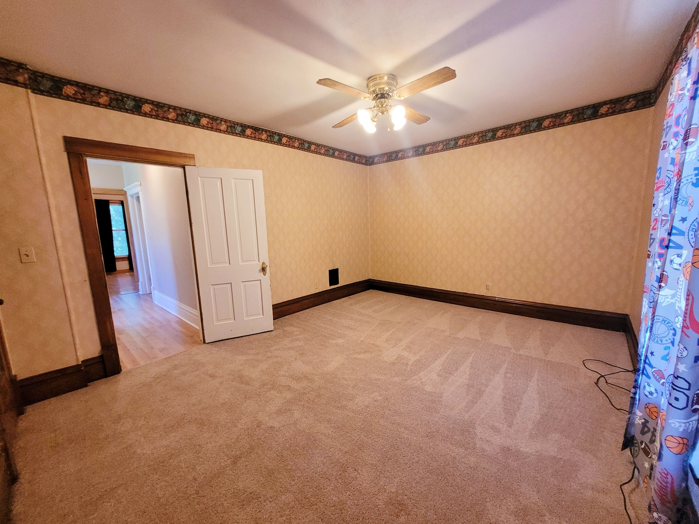 505 East Main Street Morrison, IL 61270 - Photo 22 of 27 wooden floor in an empty room with a chandelier