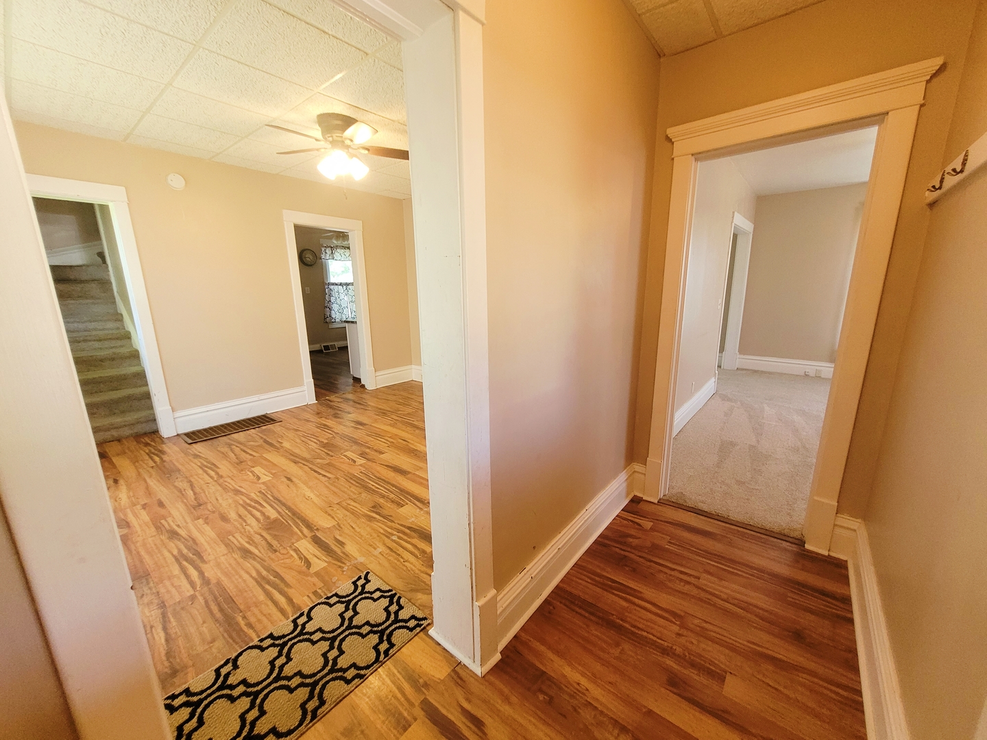 505 East Main Street Morrison, IL 61270 - Photo 4 of 27 a view of an empty room with wooden floor and a bathroom