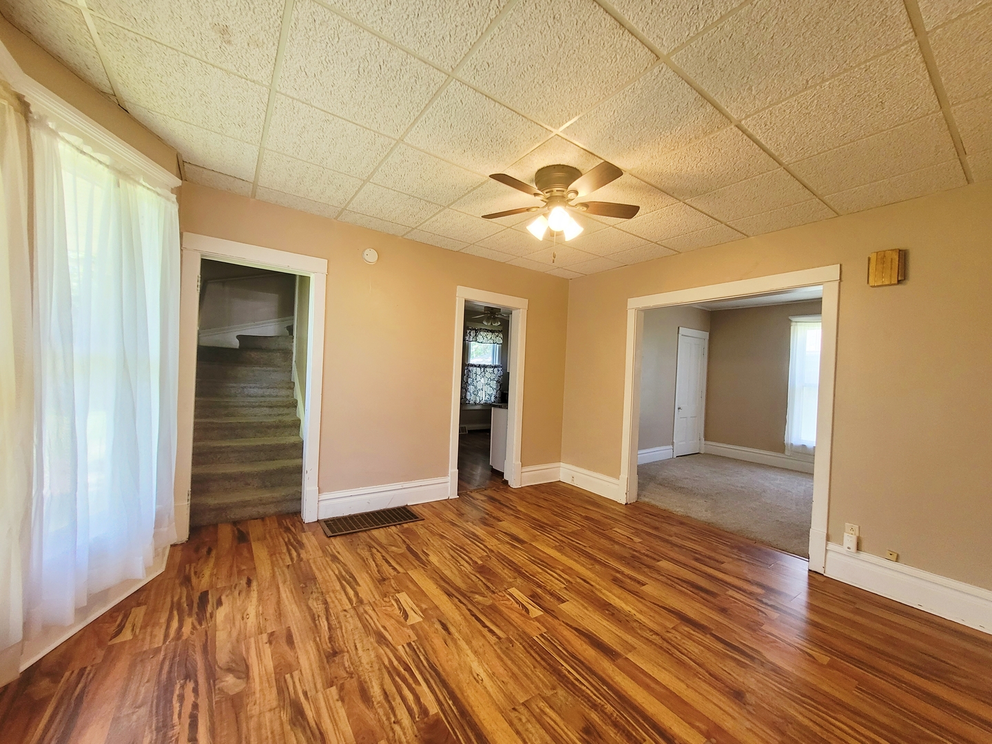 505 East Main Street Morrison, IL 61270 - Photo 6 of 27 a view of an empty room with wooden floor and a window