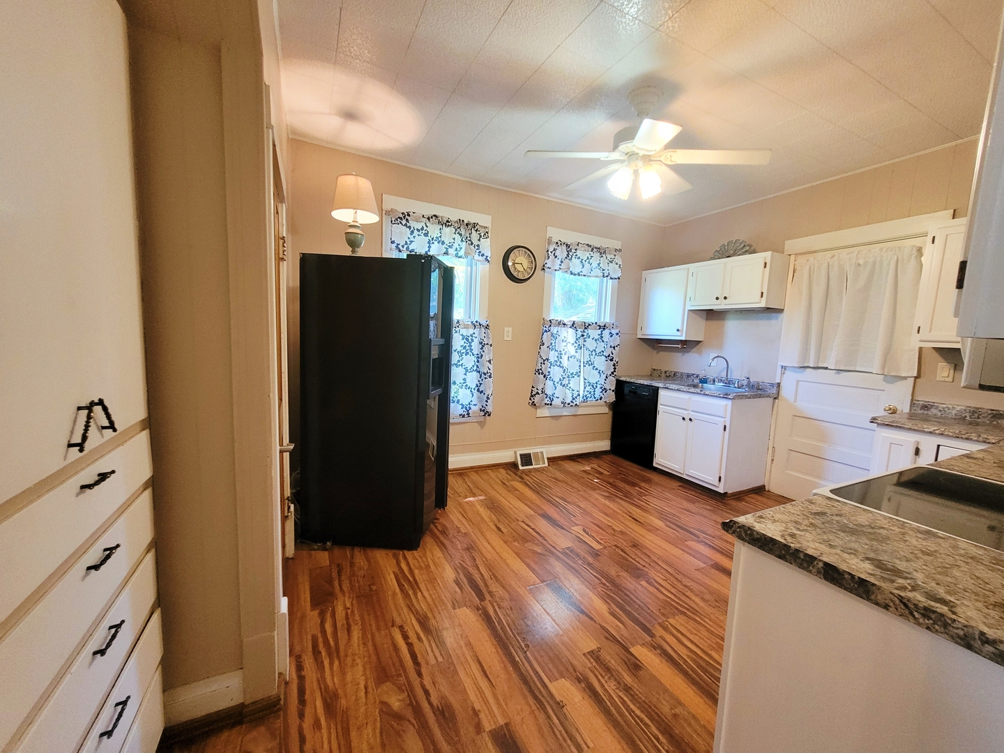 505 East Main Street Morrison, IL 61270 - Photo 7 of 27 a kitchen with a refrigerator and a stove top oven