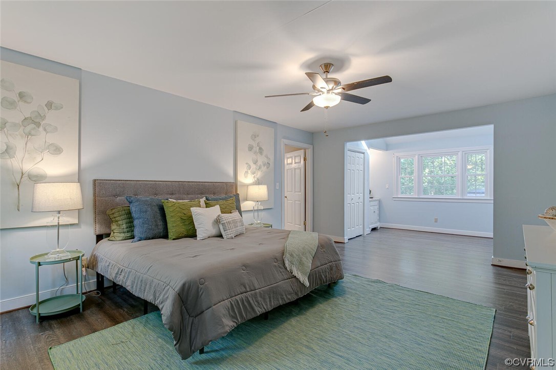 1310 King William Woods Road Midlothian, VA 23113 - Photo 19 of 42 a spacious bedroom with a bed and a chandelier