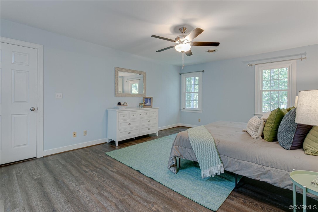 1310 King William Woods Road Midlothian, VA 23113 - Photo 20 of 42 a spacious bedroom with a bed and window