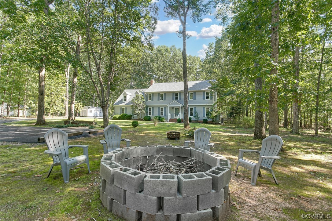 1310 King William Woods Road Midlothian, VA 23113 - Photo 2 of 42 a view of a house with swimming pool and sitting area