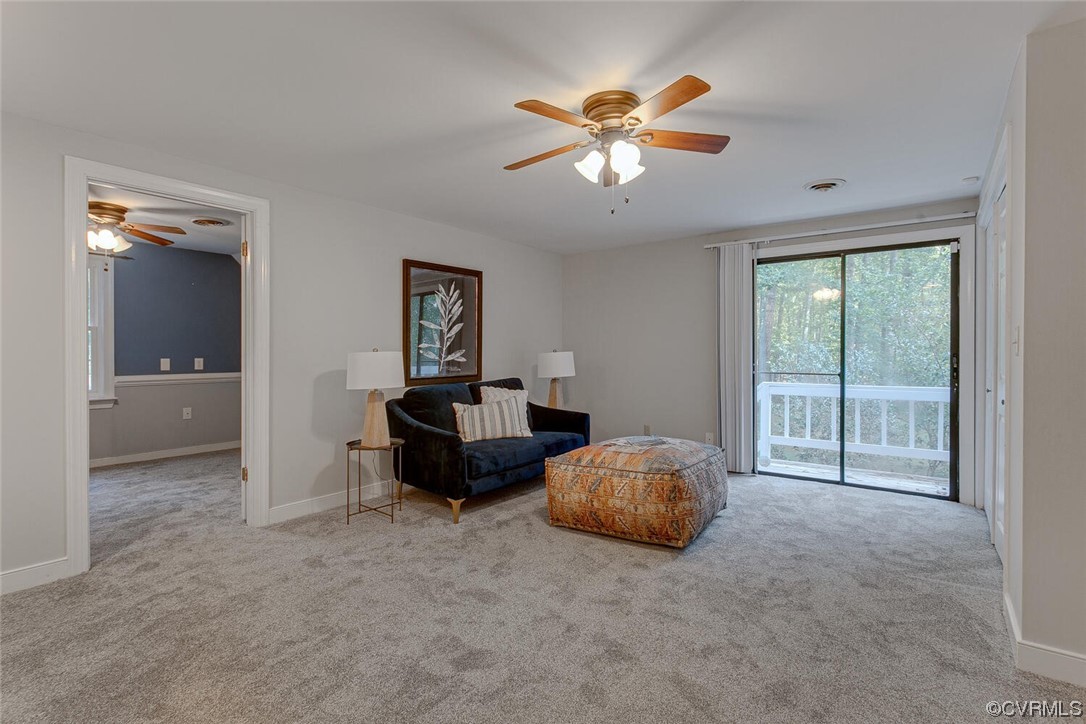1310 King William Woods Road Midlothian, VA 23113 - Photo 23 of 42 a living room with furniture and chandelier