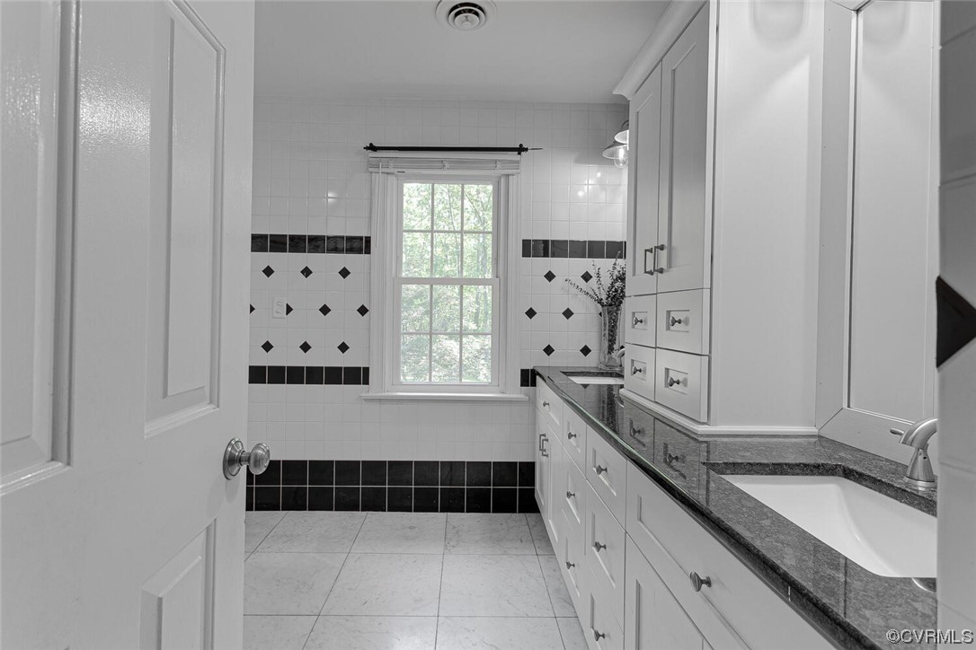 1310 King William Woods Road Midlothian, VA 23113 - Photo 27 of 42 a large white kitchen with granite countertop a sink