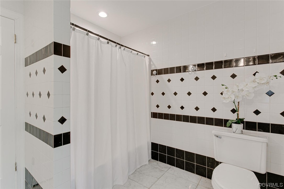 1310 King William Woods Road Midlothian, VA 23113 - Photo 28 of 42 a bathroom with a bathtub and shower