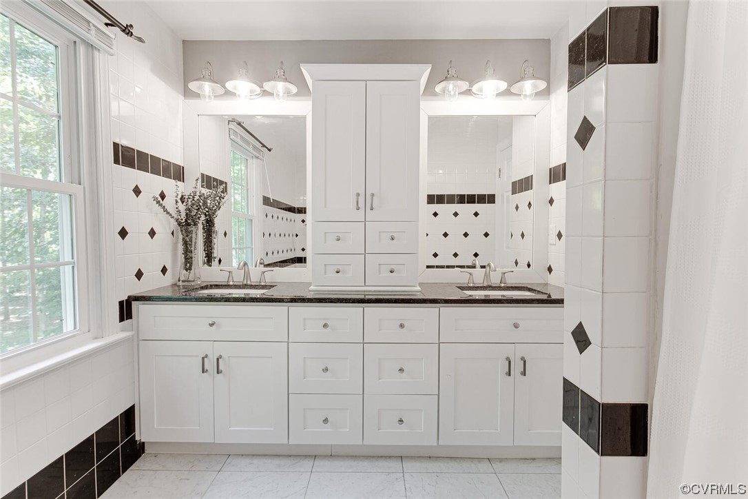 1310 King William Woods Road Midlothian, VA 23113 - Photo 29 of 42 a bathroom with a granite countertop sink mirror and a