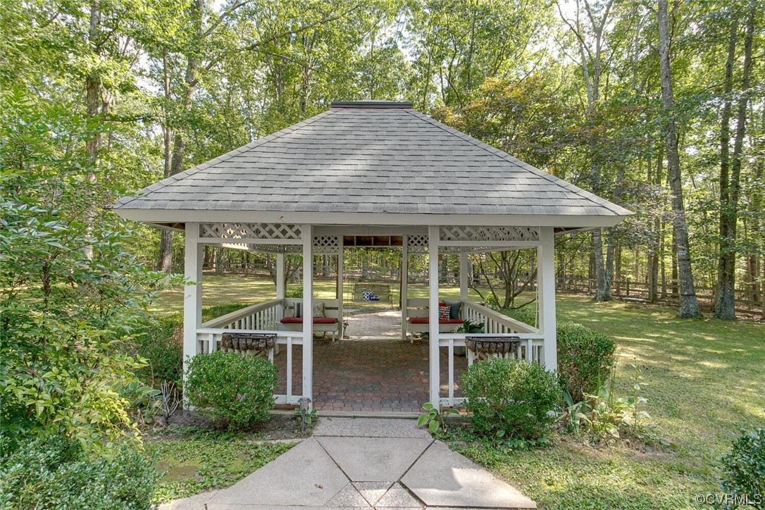 1310 King William Woods Road Midlothian, VA 23113 - Photo 33 of 42 a backyard of a house with seating space