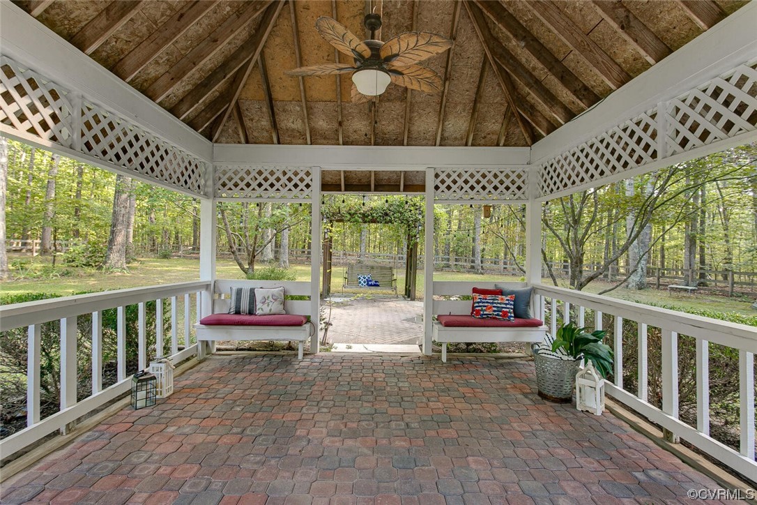 1310 King William Woods Road Midlothian, VA 23113 - Photo 35 of 42 a sitting area with furniture and wooden floor