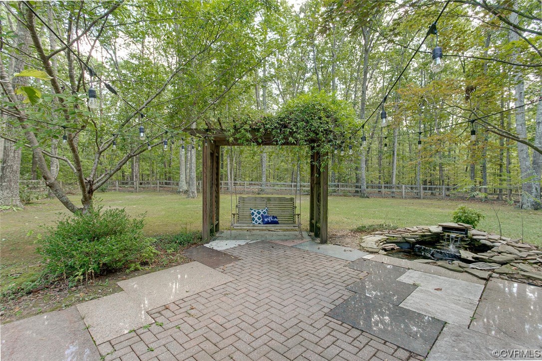 1310 King William Woods Road Midlothian, VA 23113 - Photo 36 of 42 a backyard of a house with trampoline