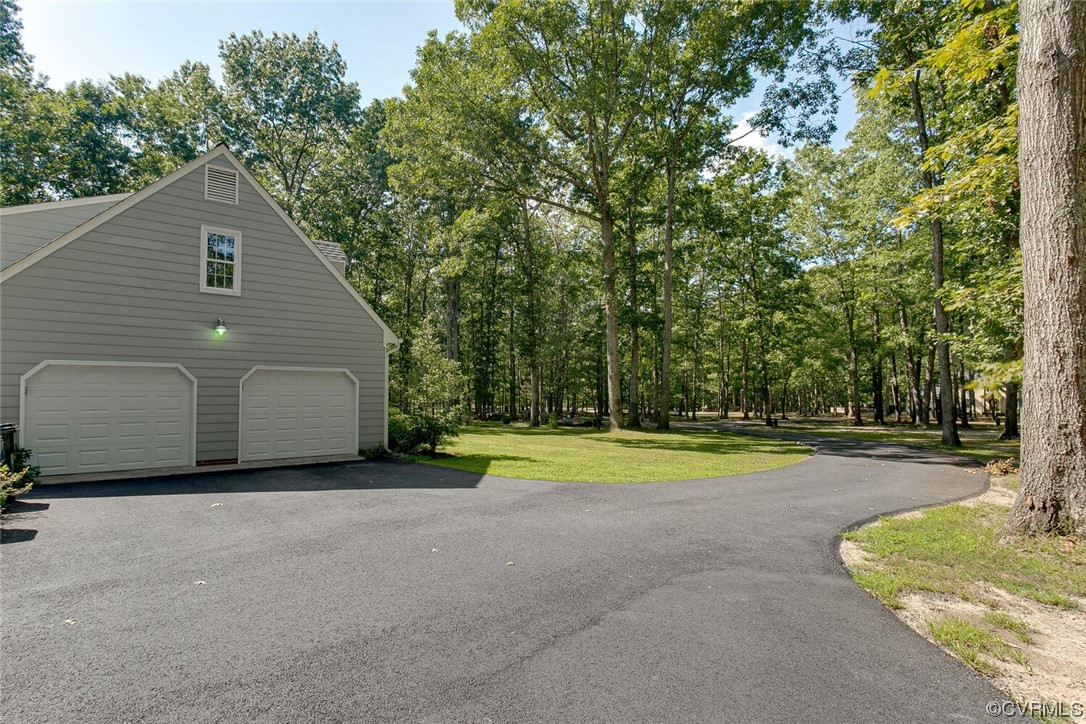 1310 King William Woods Road Midlothian, VA 23113 - Photo 41 of 42 a view of a house with backyard and trees