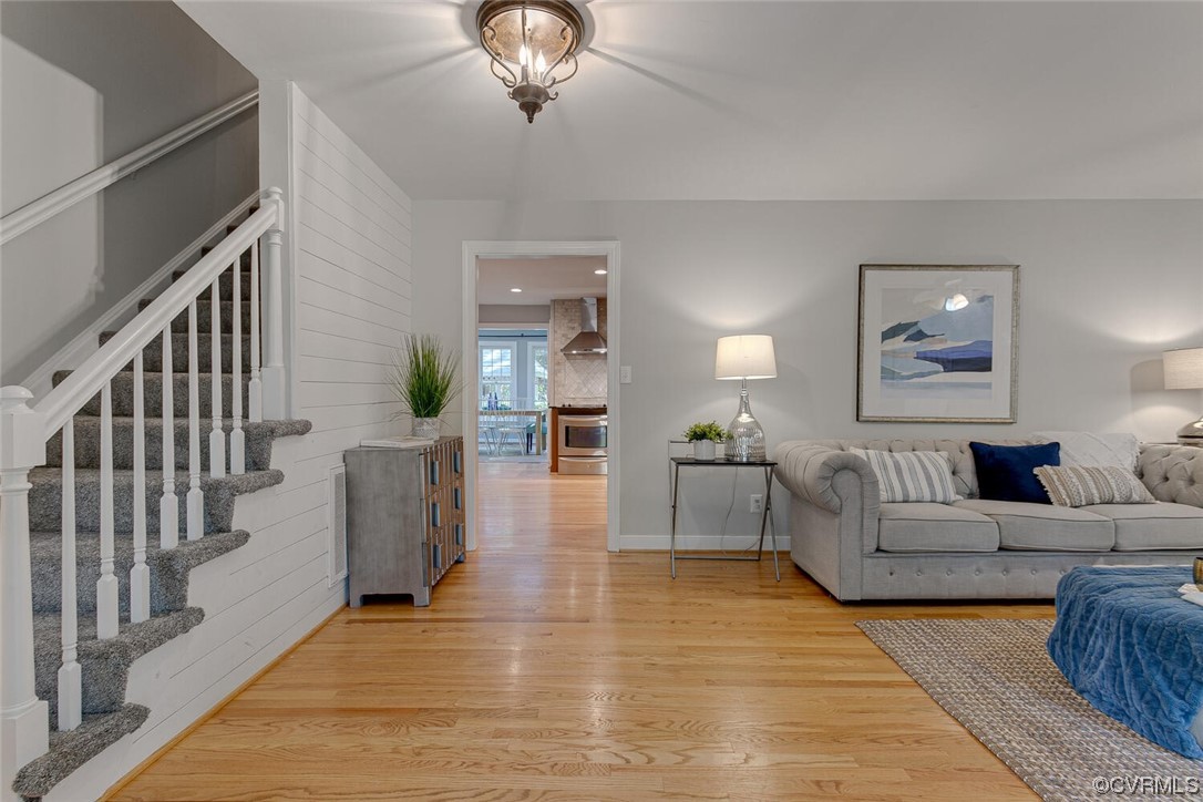 1310 King William Woods Road Midlothian, VA 23113 - Photo 5 of 42 a living room with furniture and a chandelier