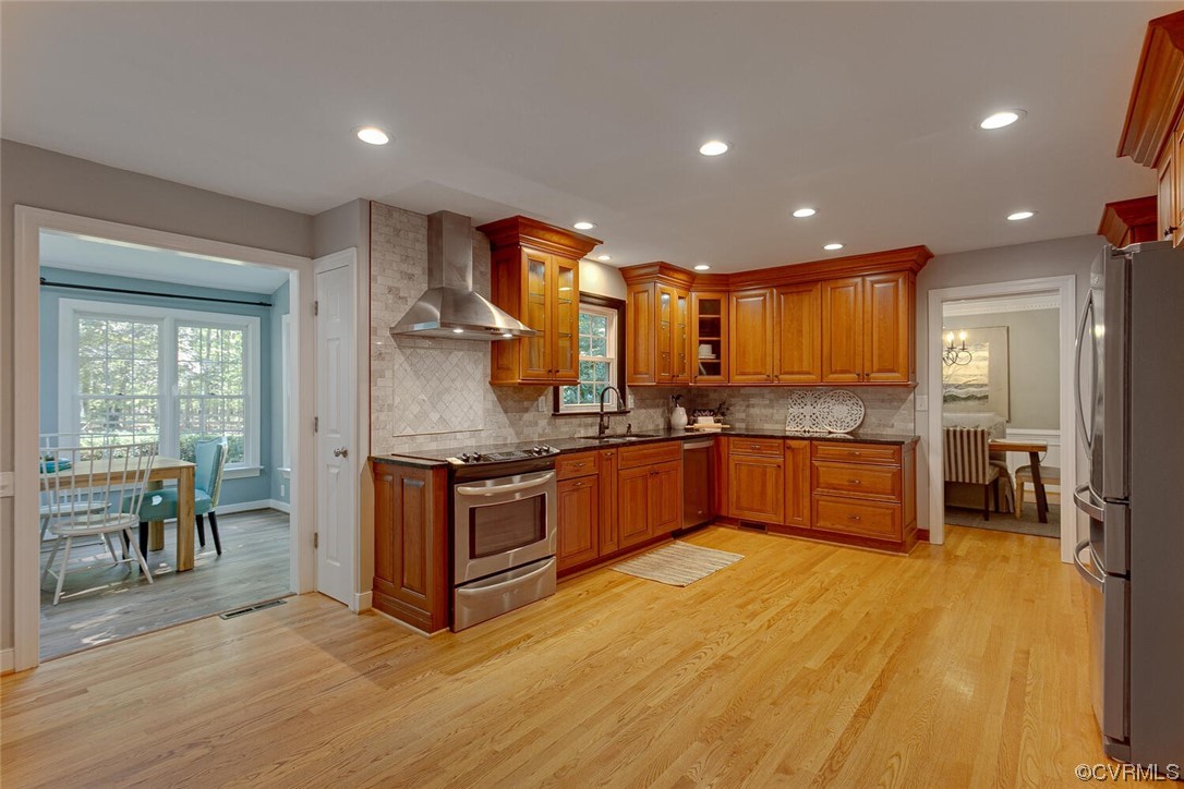 1310 King William Woods Road Midlothian, VA 23113 - Photo 9 of 42 a kitchen with stainless steel appliances granite countertop a stove a sink and a refrigerator