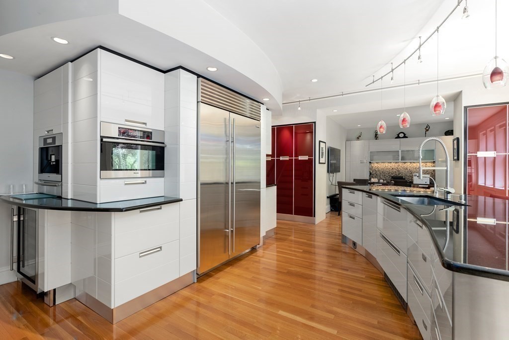 170 Hyslop Road Brookline, MA 02445 - Photo 18 of 37 a kitchen with stainless steel appliances granite countertop a refrigerator and a sink