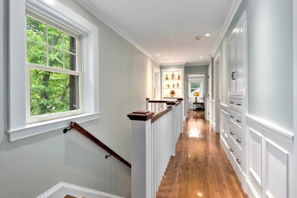 170 Hyslop Road Brookline, MA 02445 - Photo 24 of 37 a hallway with wooden floor and windows
