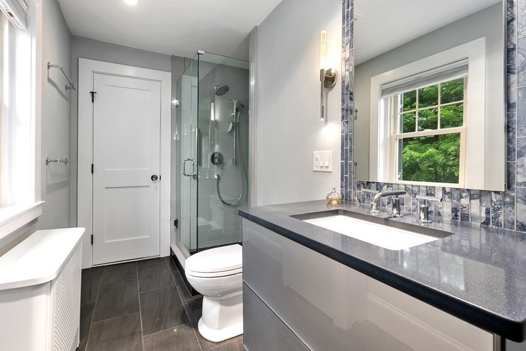 170 Hyslop Road Brookline, MA 02445 - Photo 27 of 37 a bathroom with a granite countertop sink toilet and shower