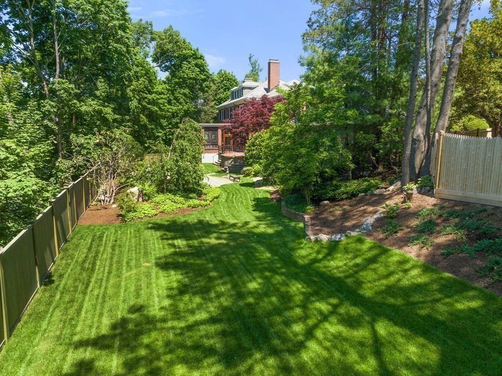 170 Hyslop Road Brookline, MA 02445 - Photo 36 of 37 a backyard of a house with lots of green space and garden