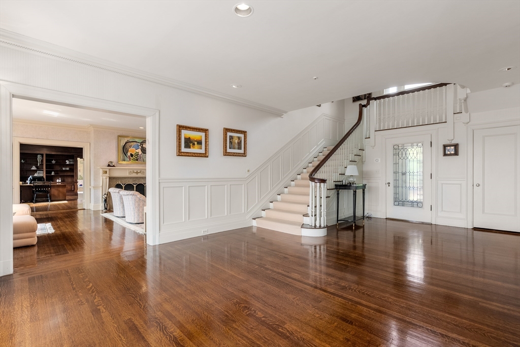 170 Hyslop Road Brookline, MA 02445 - Photo 5 of 37 a view of an empty room with wooden floor and a window