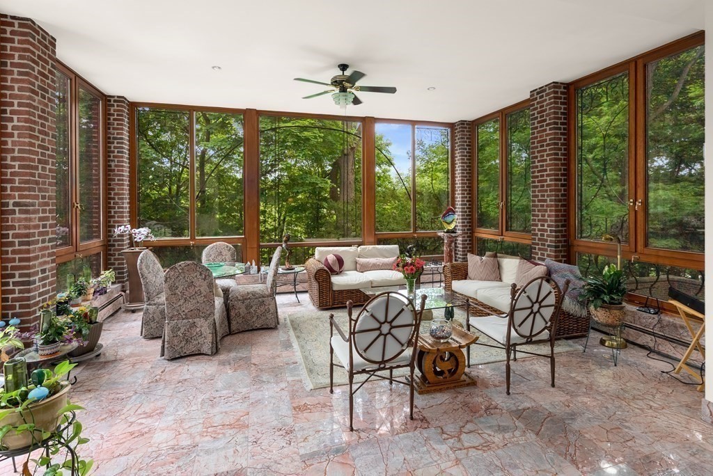 170 Hyslop Road Brookline, MA 02445 - Photo 9 of 37 a living room with furniture and a floor to ceiling window