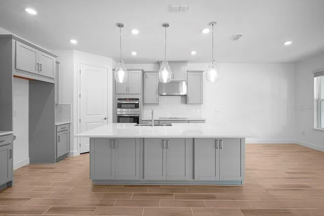 a large kitchen with cabinets