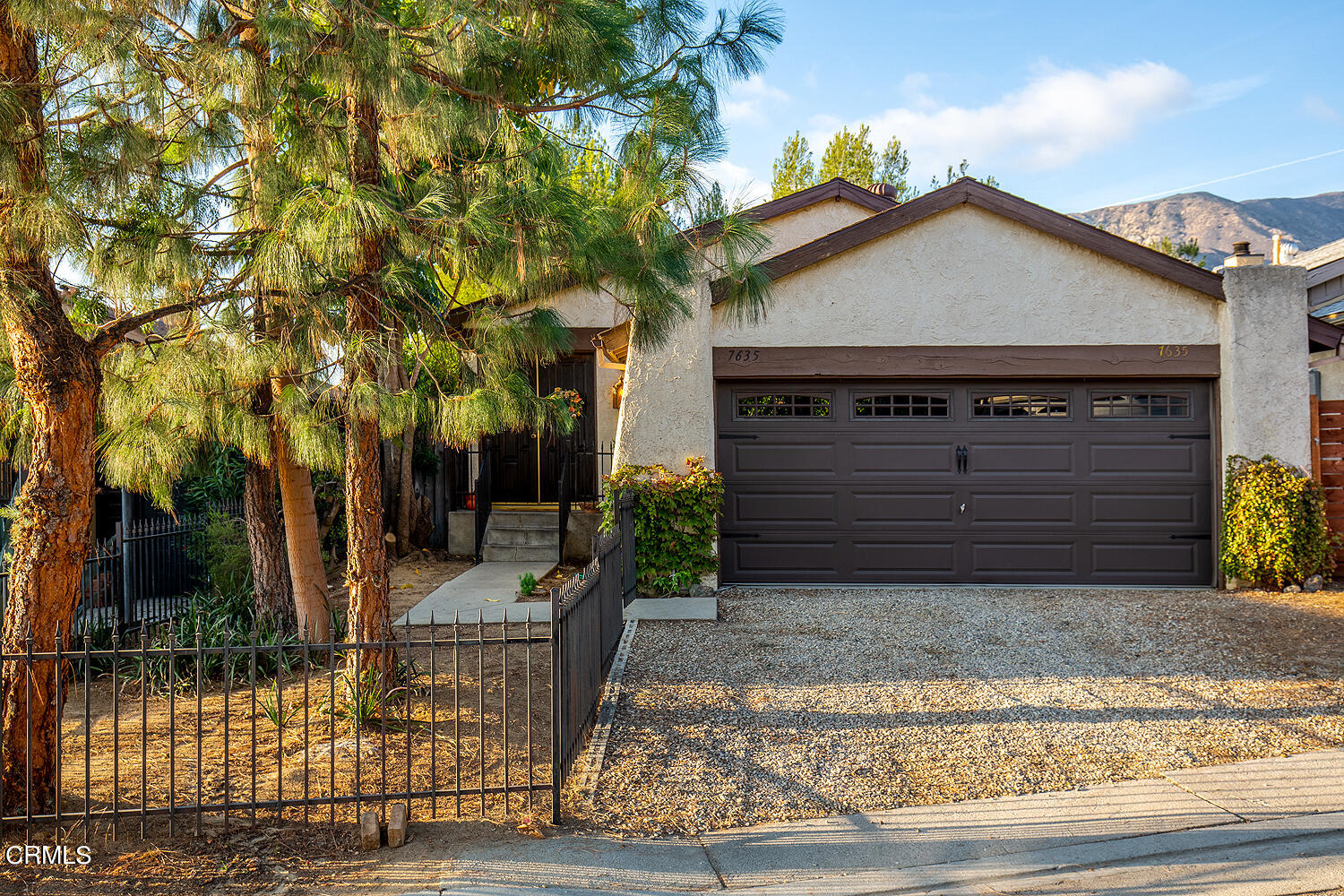 7635 Memory Drive Tujunga, CA 91042 - Photo 1 of 21 a front view of a house with garden