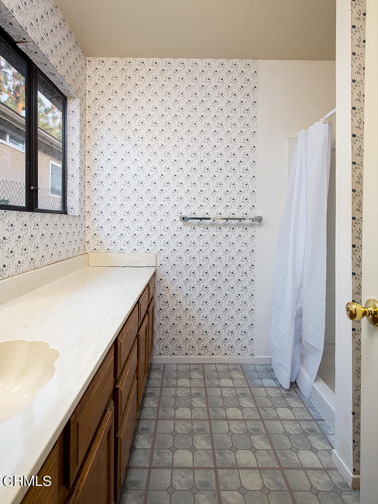 7635 Memory Drive Tujunga, CA 91042 - Photo 13 of 21 a bathroom with a sink a toilet and a shower