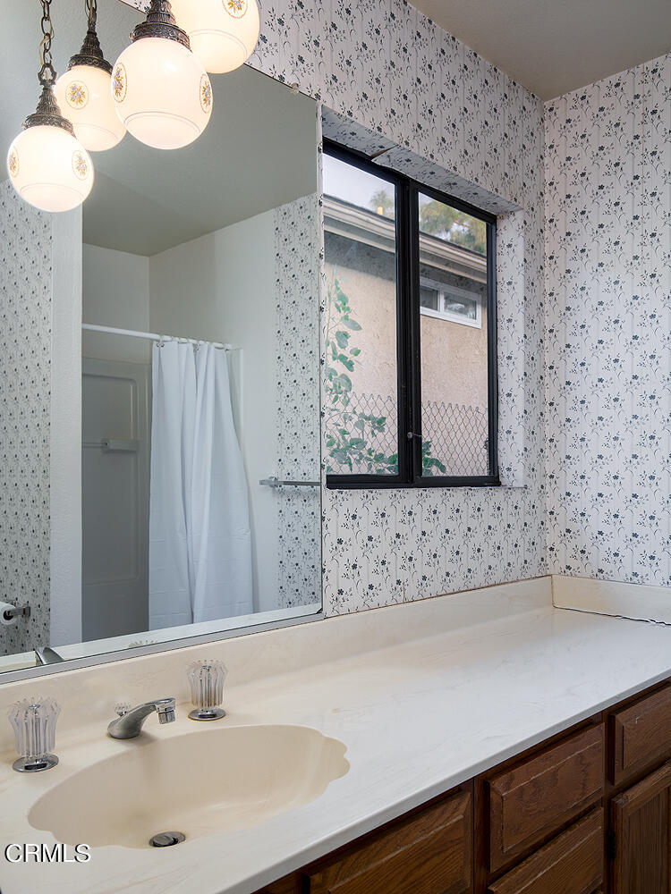 7635 Memory Drive Tujunga, CA 91042 - Photo 14 of 21 a bathroom with a sink and a mirror