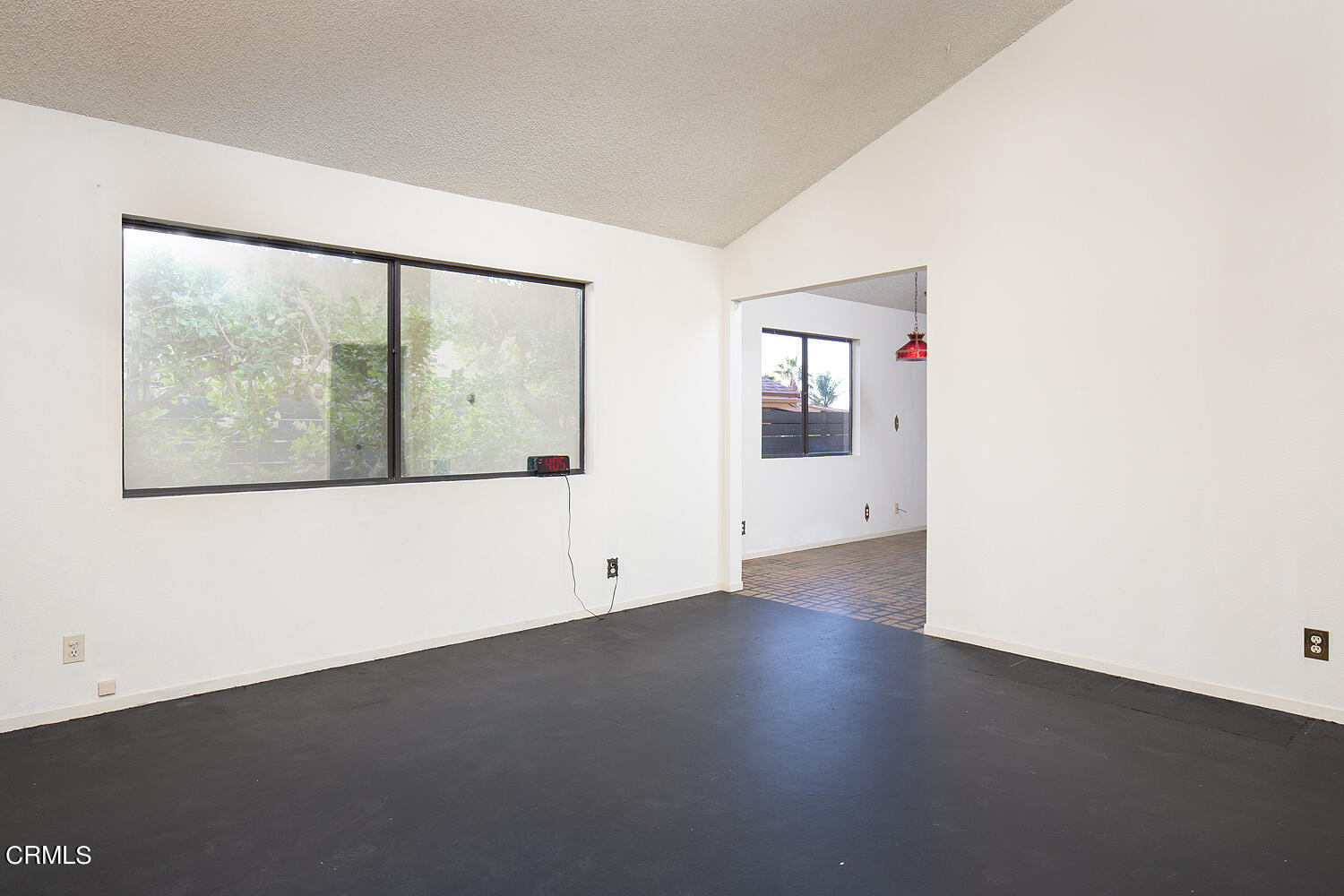 7635 Memory Drive Tujunga, CA 91042 - Photo 6 of 21 an empty room with wooden floor and windows
