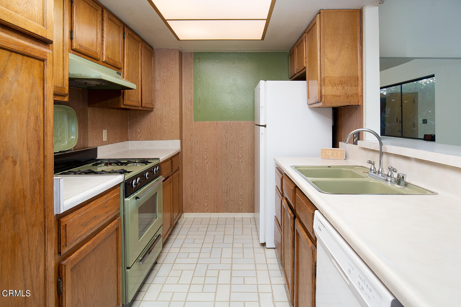 7635 Memory Drive Tujunga, CA 91042 - Photo 10 of 21 a kitchen with a sink stove and refrigerator