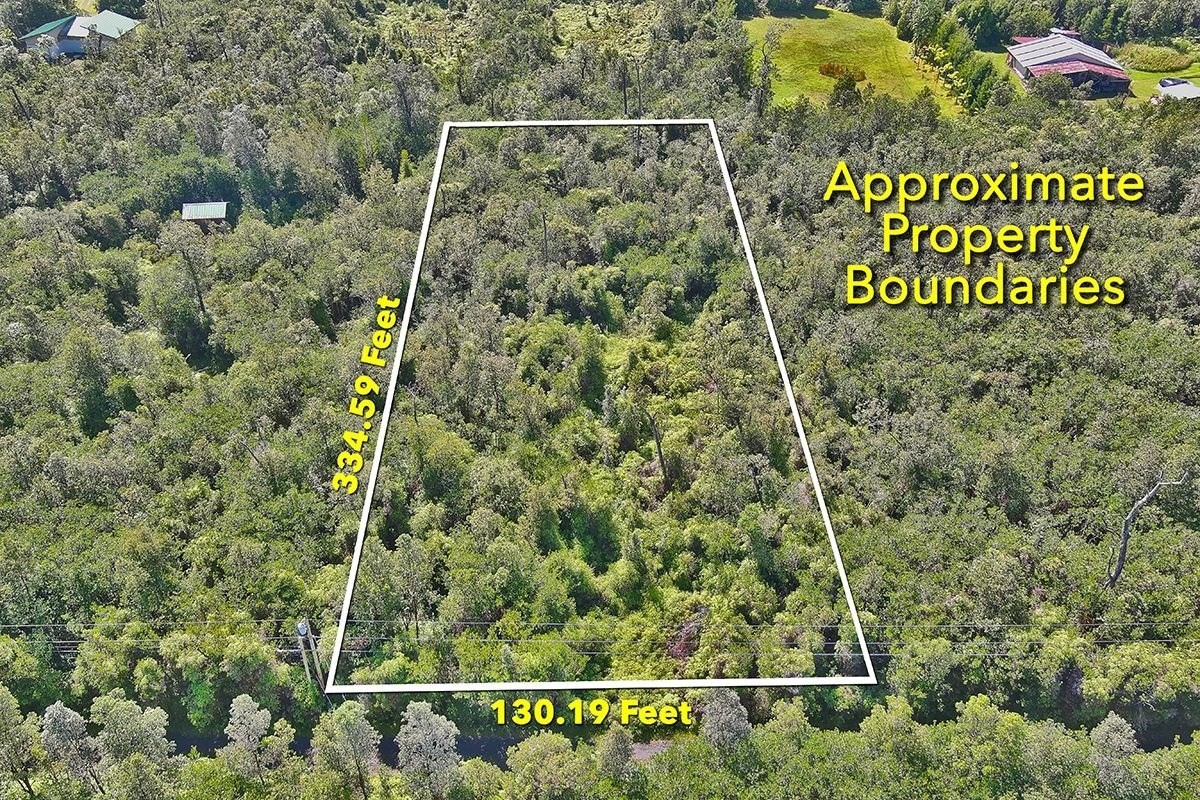 11-1863 Kolea Street Mountain View, HI 96771 - Photo 6 of 16 a sign that is sitting on a brick wall