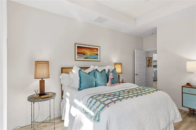 a bedroom with a bed and a table