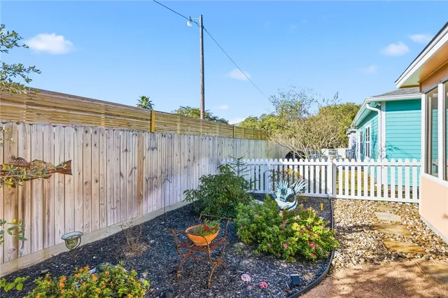 a view of a garden with a fence