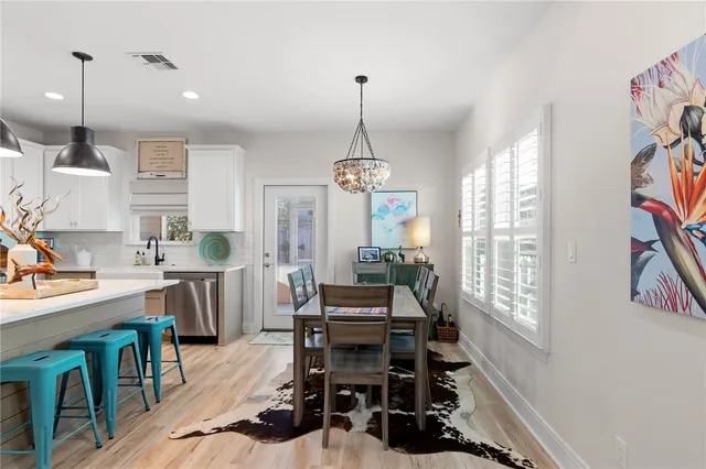 a dining room with furniture and window