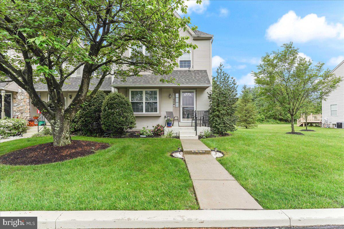 a front view of a house with a yard