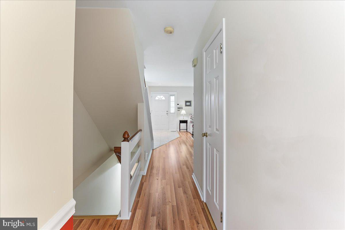 107 Cambridge Circle, Unit 50 Kennett Square, PA 19348 - Photo 11 of 36 Hall from kitchen to foyer, open basement stairs