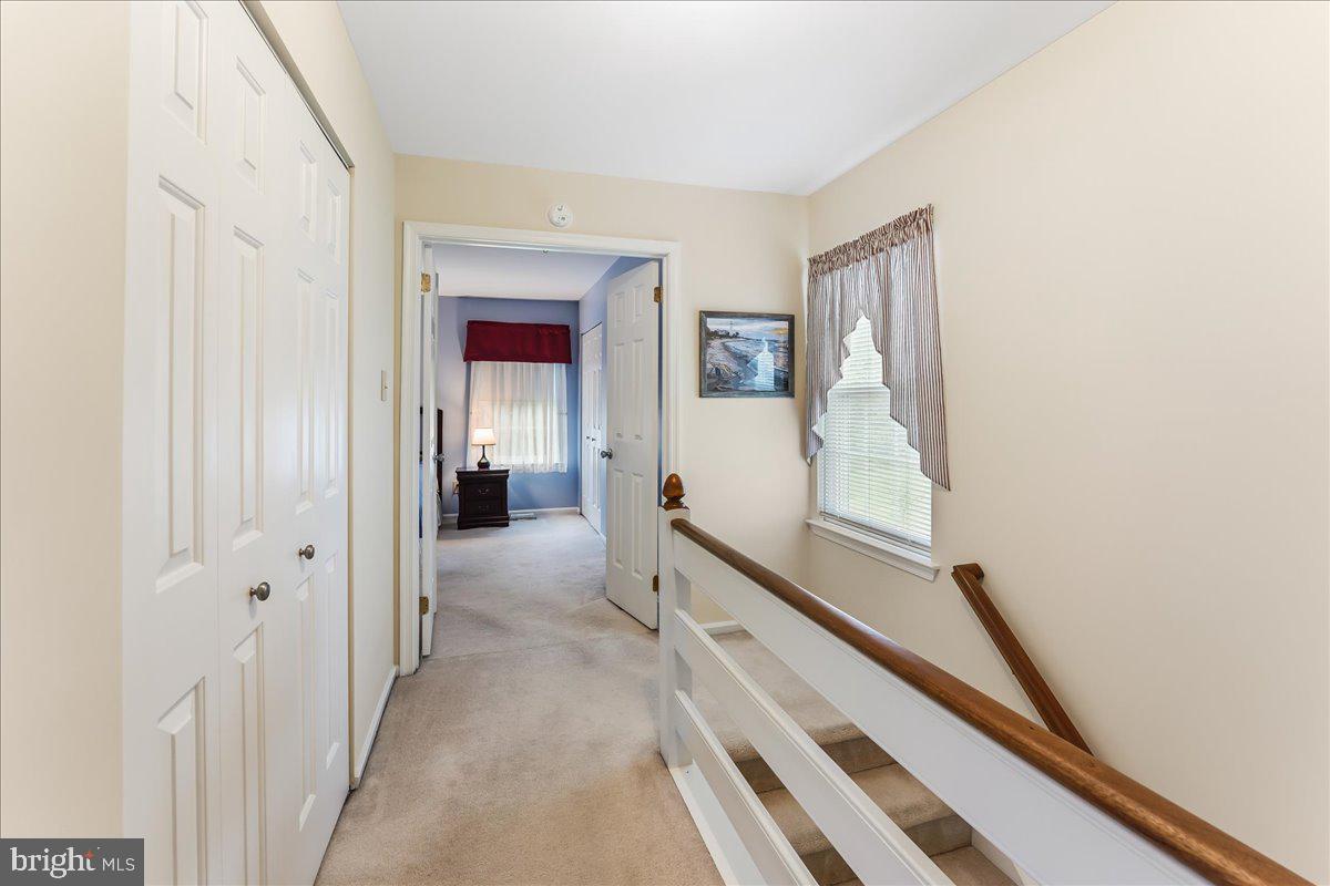 107 Cambridge Circle, Unit 50 Kennett Square, PA 19348 - Photo 19 of 36 Sunny upstairs hallway looking towards primary